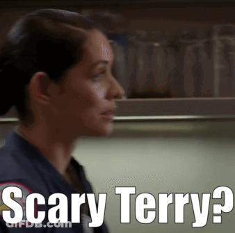 A Woman Says Scary Terry In Front Of A Shelf Full Of Glasses GIF