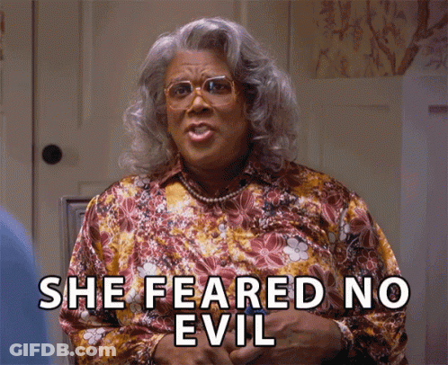 A Woman Says She Feared No Evil While Wearing Glasses And A Floral Shirt GIF