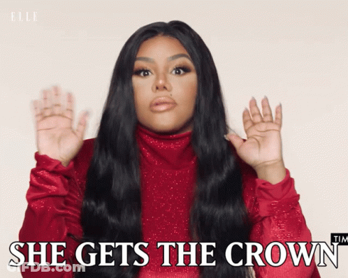 A Woman Says She Gets The Crown In A Red Sweater GIF