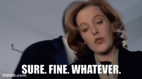 A Woman Says " Sure Fine Whatever " In Front Of A Man In A Suit . GIF