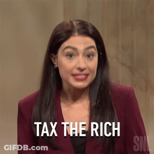 A Woman Says " Tax The Rich " While Wearing A Maroon Suit GIF