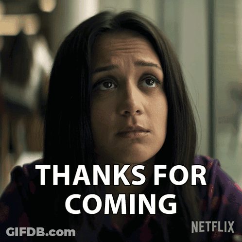 A Woman Says Thanks For Coming With A Netflix Logo Behind Her GIF