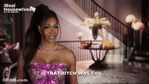A Woman Says That Bitch Was Evil In Front Of A Real Housewives Logo GIF