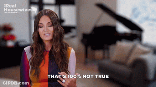 A Woman Says That 'S 100 % Not True While Standing In Front Of A Piano GIF
