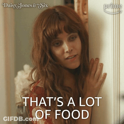 A Woman Says That 'S A Lot Of Food While Standing In Front Of A Door GIF