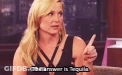 A Woman Says The Answer Is Tequila While Pointing GIF