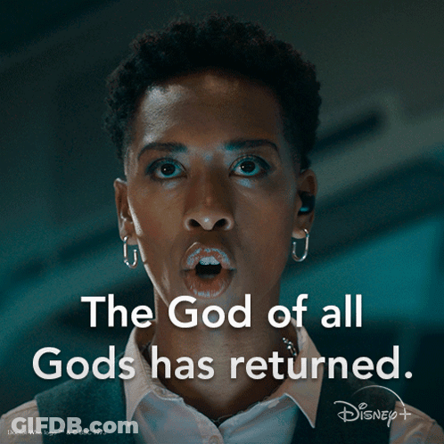 A Woman Says " The God Of All Gods Has Returned " In A Dark Room GIF