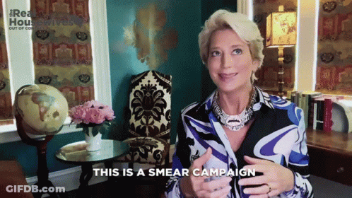 A Woman Says This Is A Smear Campaign In Front Of A Chair GIF
