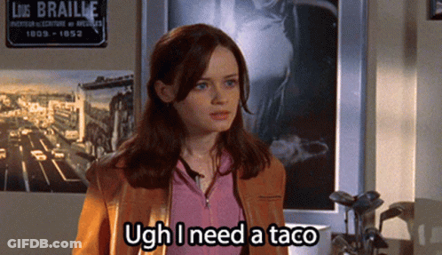 A Woman Says Ugh I Need A Taco In Front Of A Sign For Liz Braille GIF