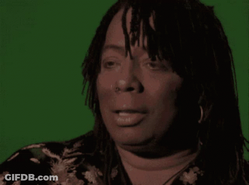 A Woman Says Vaccines Are A Hell Of A Drug In Front Of A Green Background GIF