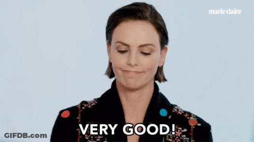 A Woman Says " Very Good " In Front Of A Marie Claire Ad GIF