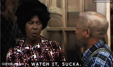 A Woman Says Watch It Sucka While Talking To A Man In A Plaid Shirt GIF