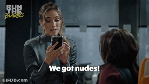 A Woman Says We Got Nudes While Looking At Her Cell Phone GIF