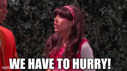 A Woman Says " We Have To Hurry " In Front Of A Bush GIF