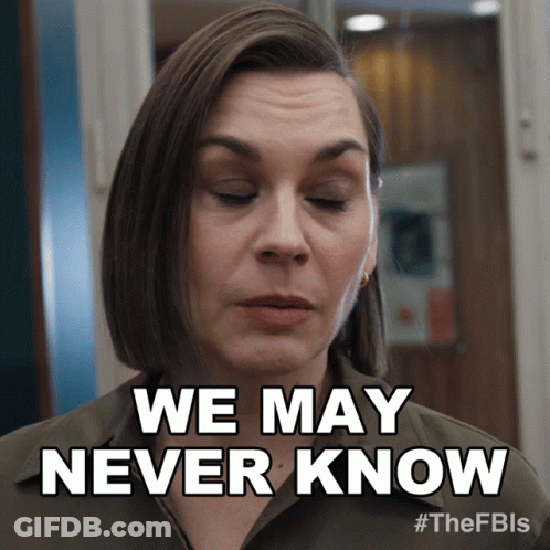 A Woman Says " We May Never Know " In Front Of A Door GIF
