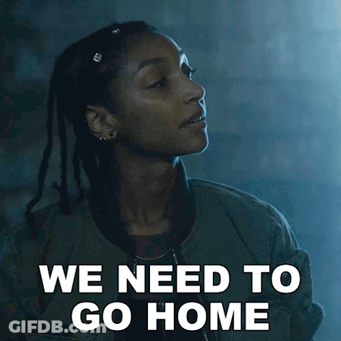 A Woman Says We Need To Go Home In A Dark Room GIF
