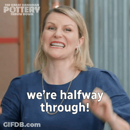 A Woman Says " We 'Re Halfway Through " While Wearing A Blue Shirt GIF