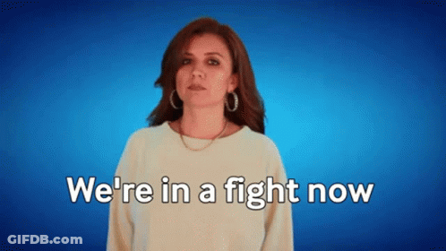 A Woman Says " We 'Re In A Fight Now " On A Blue Background GIF