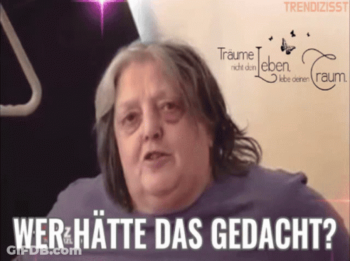 Woman Says Wer Hatte Das Gedacht In Front Of Traume Sign GIF