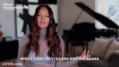 A Woman Says " What Can I Say Class Knows Class " While Standing In Front Of A Piano GIF