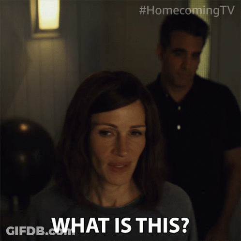 A Woman Says What Is This While A Man Stands In The Background GIF