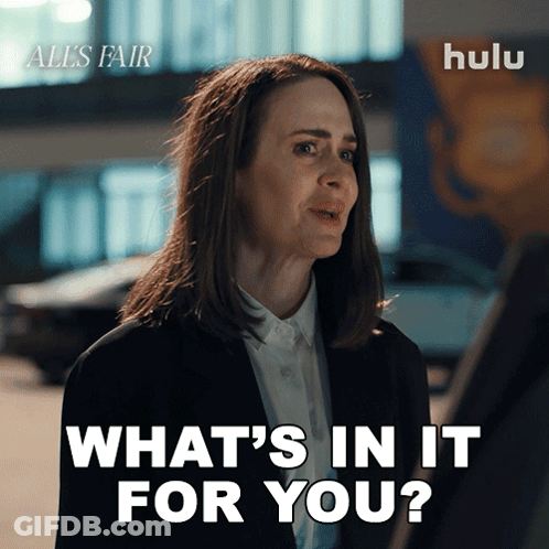 A Woman Says What 'S In It For You In Front Of A Hulu Logo GIF
