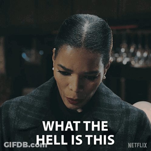 A Woman Says What The Hell Is This With A Netflix Logo Behind Her GIF