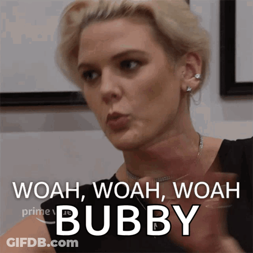 A Woman Says Woah Woah Woah Bubby While Holding A Glass Of Wine GIF