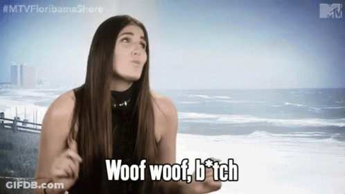 A Woman Says Woof Woof B * Tch In Front Of The Ocean GIF