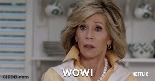 A Woman Says Wow In Front Of A Netflix Ad GIF