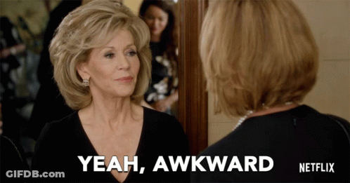 A Woman Says Yeah Awkward While Looking At Herself In A Mirror GIF
