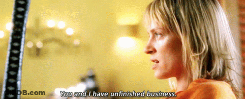 A Woman Says " You And I Have Unfinished Business " In A Movie Scene GIF