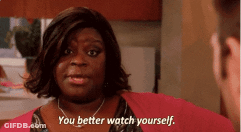 A Woman Says " You Better Watch Yourself " While Looking At A Man GIF