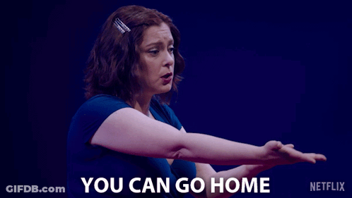 A Woman Says " You Can Go Home " In Front Of A Blue Background GIF