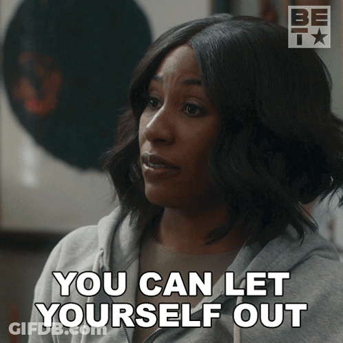A Woman Says " You Can Let Yourself Out " While Wearing A Grey Sweatshirt GIF