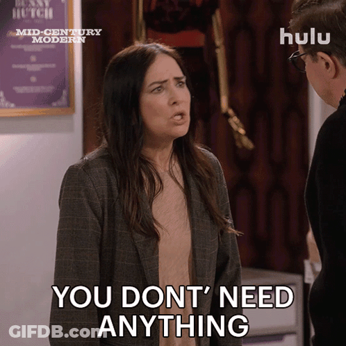 A Woman Says " You Don 'T Need Anything " In Front Of A Man GIF