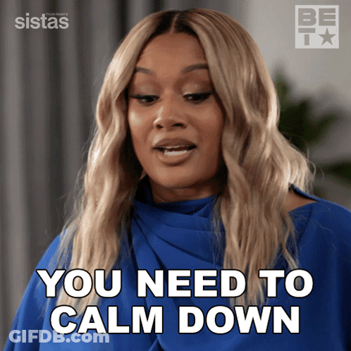 A Woman Says You Need To Calm Down In A Blue Shirt GIF