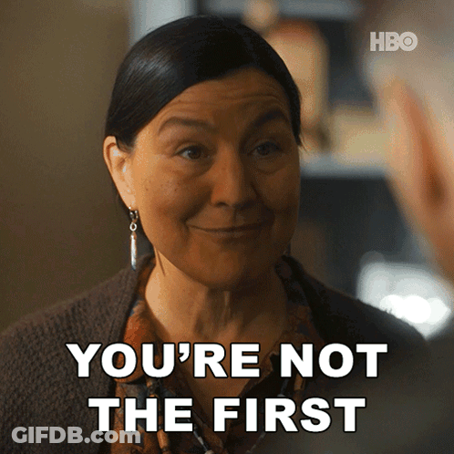 A Woman Says " You 'Re Not The First " While Smiling GIF