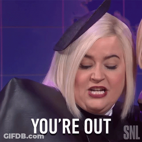 A Woman Says You 'Re Out While Wearing A Black Cape GIF