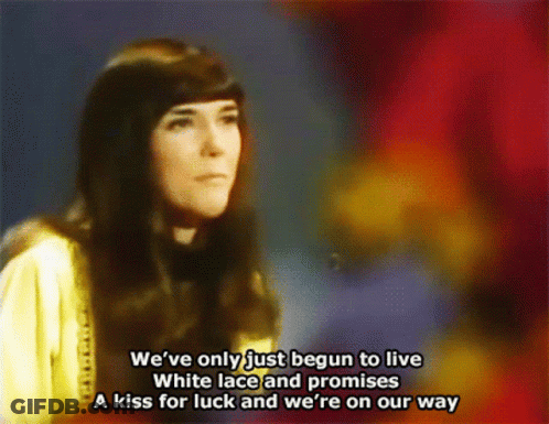 A Woman Singing A Song That Says We 'Ve Only Just Begun To Live GIF