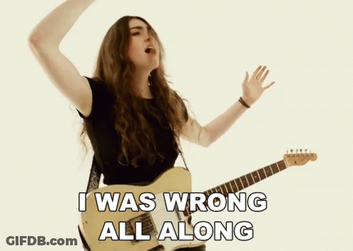 A Woman Singing And Playing A Guitar With The Words I Was Wrong All Along Below Her GIF