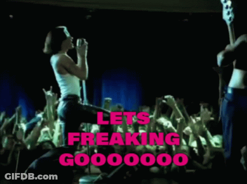A Woman Singing Into A Microphone In Front Of A Crowd With The Words Lets Freaking Go000000 Written In Pink GIF