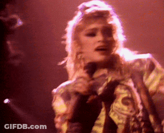 Woman Singing Into Microphone On Stage GIF