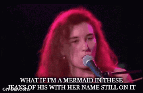 A Woman Singing Into A Microphone With A Caption That Says What If I 'M A Mermaid In These Jeans Of His GIF