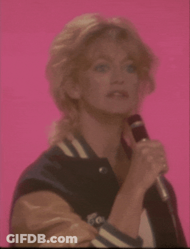 A Woman Singing Into A Microphone With The Word Football Written Below Her GIF