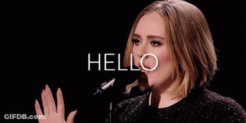 A Woman Singing Into A Microphone With The Word Hello Written Above Her GIF