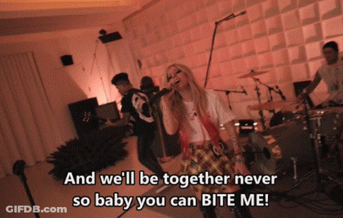 A Woman Singing Into A Microphone With The Words " And We 'Ll Be Together Never So Baby You Can Bite Me " Below Her GIF