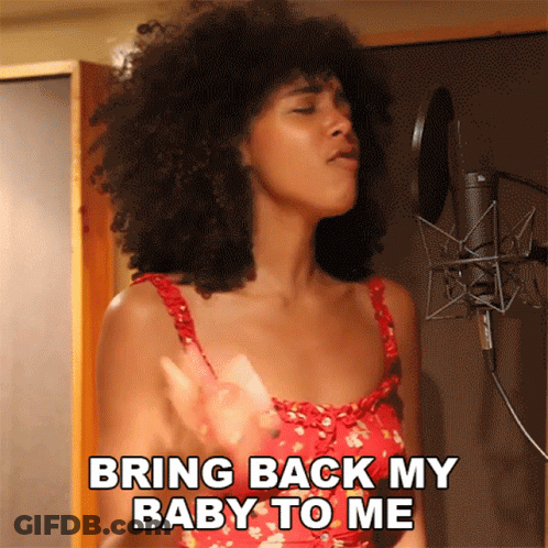 A Woman Singing Into A Microphone With The Words Bring Back My Baby To Me GIF