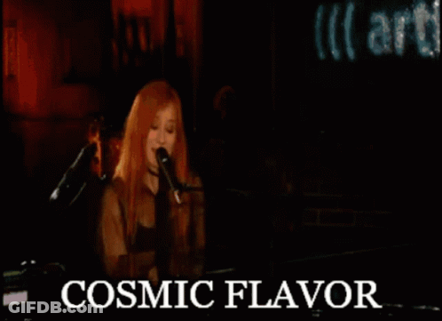 Woman Singing Into Microphone With Cosmic Flavor Text GIF