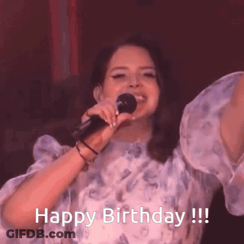 A Woman Singing Into A Microphone With The Words Happy Birthday GIF